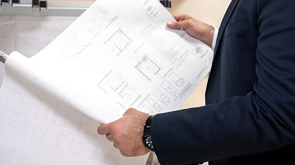 An engineer checks out a schematic at CFI Companies.